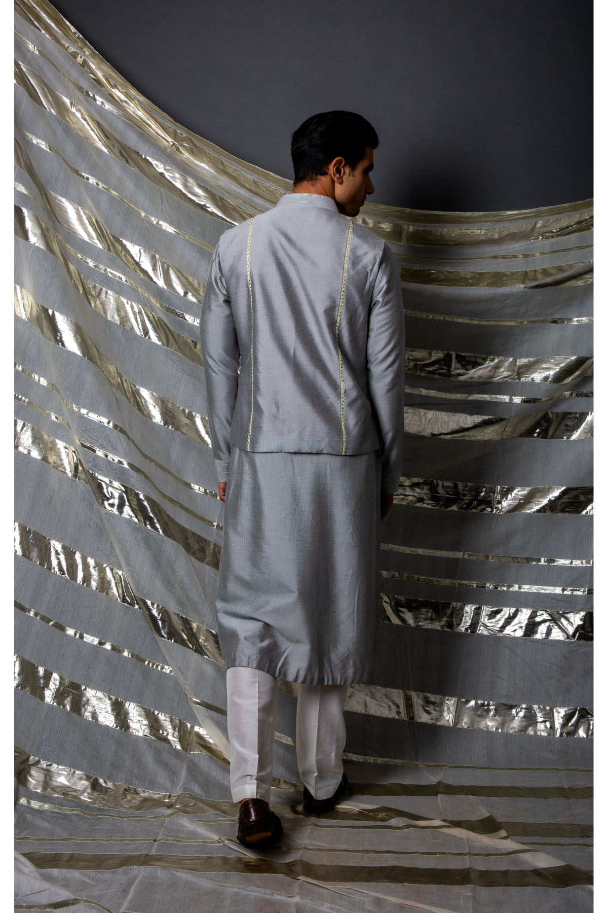 Grey bandi jacket paired with long kurta and pyjama pants - Kunal Anil Tanna