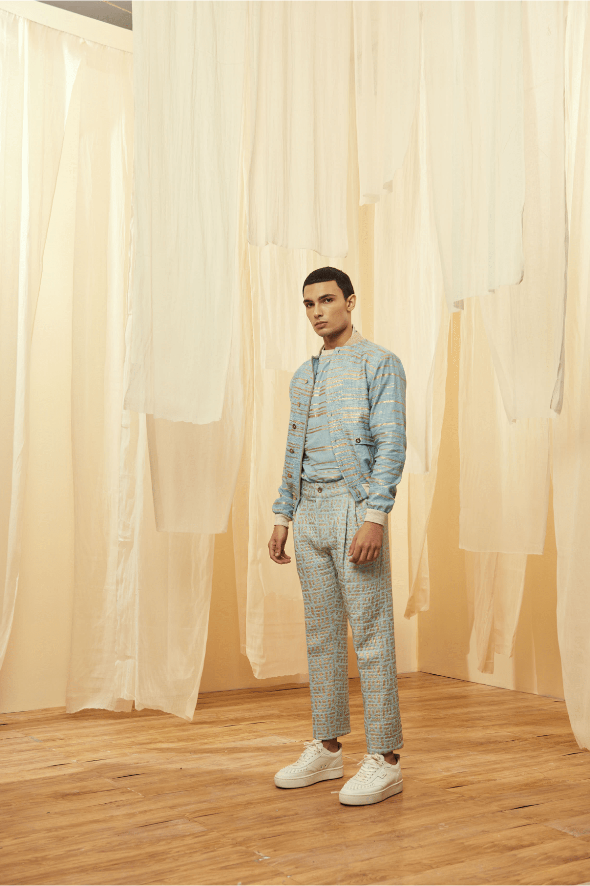 Blue Bomber Jacket with a Blue Poloneck and Blue Trousers - Kunal Anil Tanna