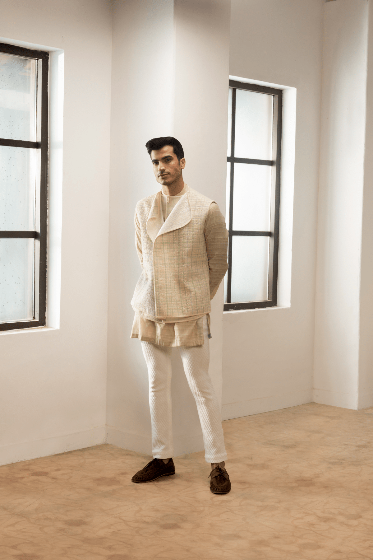 Ivory textured jacket with  off white kurta and white pants. - Kunal Anil Tanna